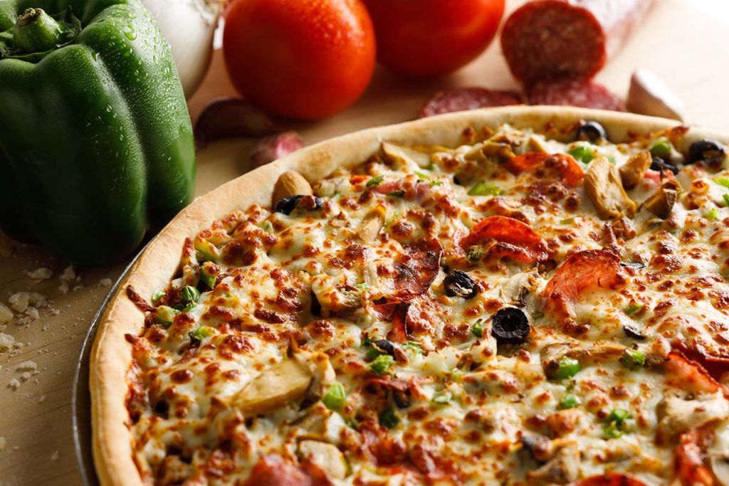 Mobster Pizza Staged with Fresh Vegetables